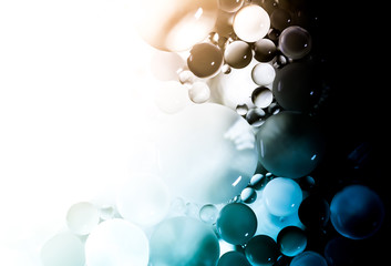 Creative abstraction background from colorful circles of different sizes with backlight and gradient.