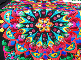  Close up of сolorful embroidered decorative textile from Otavalo city at the artisans market