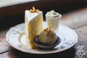 Coconut and ice cream cake on a white plate