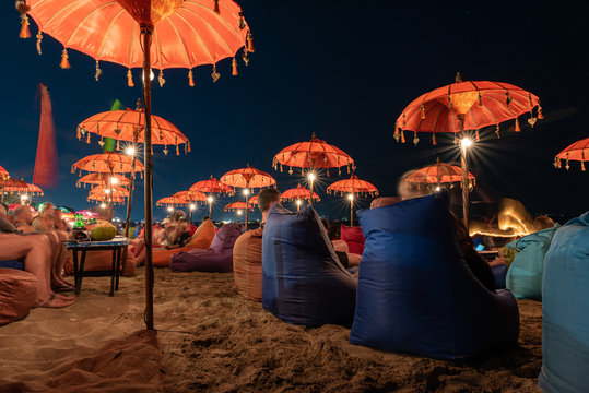 long exposure of the kuta beach bar chairs at night - Powered by Adobe