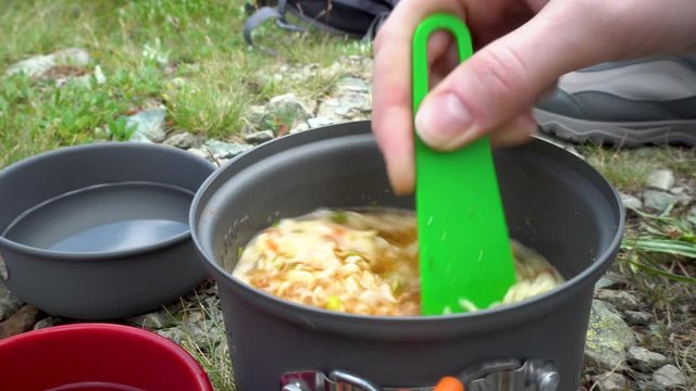 Cooking sublimated food. Sublimated food and tourist dishes. Easy way to eat when you're camping. 4k footage.