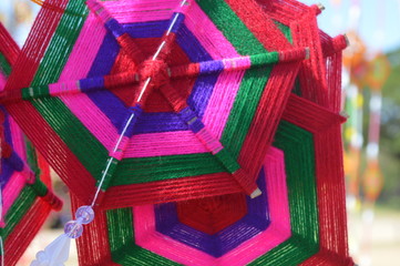 The surface of the fabric is colorful. Hanging on the bamboo in the temple