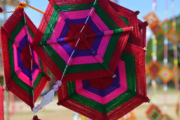 The surface of the fabric is colorful. Hanging on the bamboo in the temple