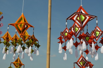 The surface of the fabric is colorful. Hanging on the bamboo in the temple