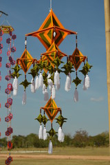 The surface of the fabric is colorful. Hanging on the bamboo in the temple