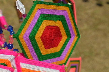 The surface of the fabric is colorful. Hanging on the bamboo in the temple