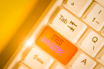 Conceptual hand writing showing Stress Management. Concept meaning method of limiting stress and its effects by learning ways White pc keyboard with note paper above the white background