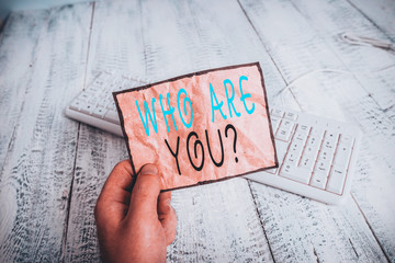 Conceptual hand writing showing Who Are You Question. Concept meaning asking about someone identity...