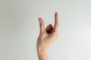 Female hand holds an imaginary object on a white background