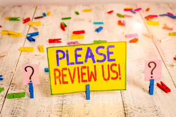 Text sign showing Please Review Us. Business photo text situation or system is formal examination by showing authority Scribbled and crumbling sheet with paper clips placed on the wooden table