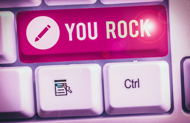 Text sign showing You Rock. Business photo text slang phrase of praise or encouragement conveying you are awesome