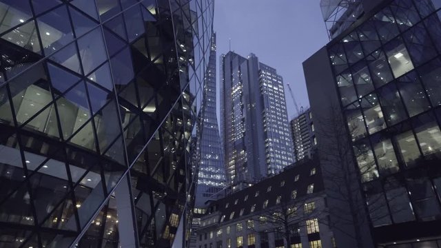 Illuminated offices of the skycrapers of London during the night.