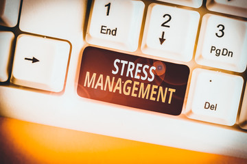 Conceptual hand writing showing Stress Management. Concept meaning method of limiting stress and its effects by learning ways White pc keyboard with note paper above the white background