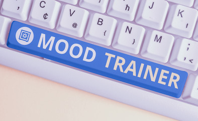 Handwriting text Mood Trainer. Conceptual photo a demonstrating who trains to alleviate mood disorders of a demonstrating White pc keyboard with empty note paper above white background key copy space