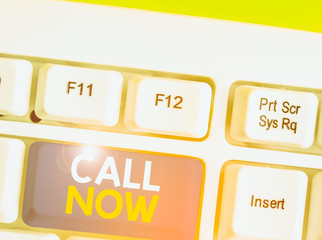 Writing note showing Call Now. Business concept for To immediately contact a demonstrating using...