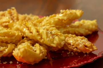 sweet chat with honey syrup in a red dish