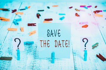 Writing note showing Save The Date. Business concept for Organizing events well make day special event organizers Crumbling sheet with paper clips placed on the wooden table