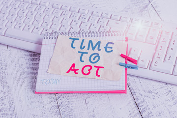 Conceptual hand writing showing Time To Act. Concept meaning Do it now Response Immediately Something need to be done notebook reminder clothespin with pinned sheet light wooden