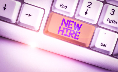 Handwriting text New Hire. Conceptual photo someone who has not previously been employed by the organization White pc keyboard with empty note paper above white background key copy space