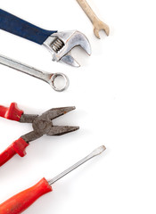 Adjustable wrenches and pliers isolated on a white