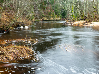 landscape with sandstone cliff and river