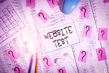 Conceptual hand writing showing Website Test. Concept meaning test the websites or web applications for potential bugs Writing tools and scribbled paper on top of the wooden table