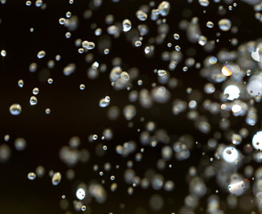 Water splashing from a fountain on summer nature