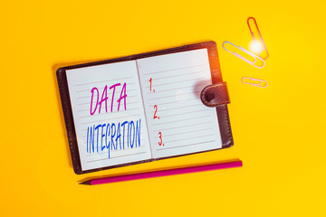 Conceptual hand writing showing Data Integration. Concept meaning involves combining data residing in different sources Dark leather locked diary striped sheets marker colored background