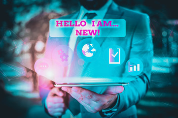 Writing note showing Hello I Am New. Business concept for introducing oneself in a group as fresh worker or student Male human wear formal suit presenting using smart device
