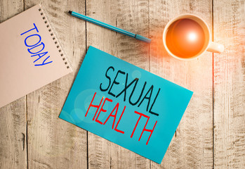 Writing note showing Sexual Health. Business concept for positive and respectful approach to sexual relationships Stationary placed next to a cup of black coffee above the wooden table