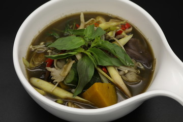 Thai herb soup with mushrooms and pumpkin