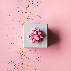 Gift box on pink background.
