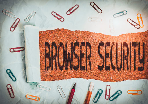Conceptual hand writing showing Browser Security. Concept meaning security to web browsers in order to protect networked data Stationary and torn cardboard on a wooden classic table backdrop