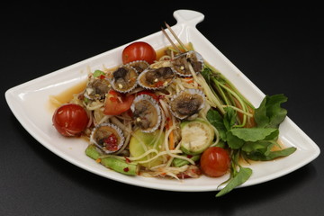 Somtum (Thai spicy salad) with scallop and vegetable in white plate