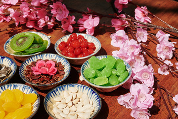 Delicious driend fruits and berries with various seeds on table served for Lunar New Year celebration