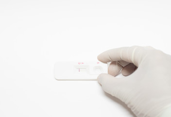 Scientist testing strip test on white background.