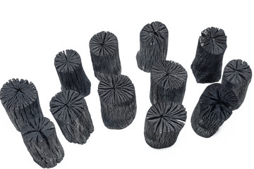 Natural wood charcoals isolated on white background.