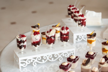 Candy bar. Table with sweets, candies, dessert. Delicious sweet buffet with cupcakes