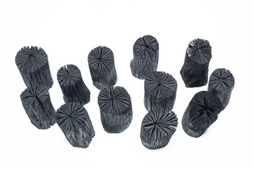 Natural wood charcoals isolated on white background.