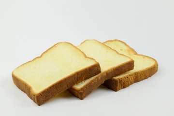 Sliced of yellow bread on white background