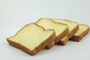 Sliced of yellow bread on white background