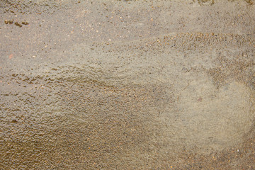View of wet cement floor texture. use for wet floor background