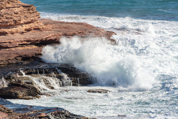 waves crashing on rocks