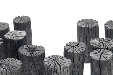 Natural wood charcoals isolated on white background.