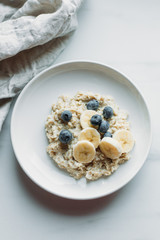 Healthy Breakfast, Blueberry Oatmeal on marble background with copy space
