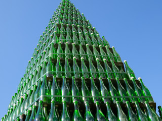 Christmas tree of bottles of champagne. Creative from bottles. Empty bottles of champagne