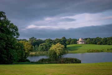 Fototapeta na wymiar An calm autumn day overlooking the lake at Hardwick Park in Sedgefield, County Durham, UK