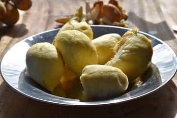 Durian on metal plate outdoors. Thai fruit