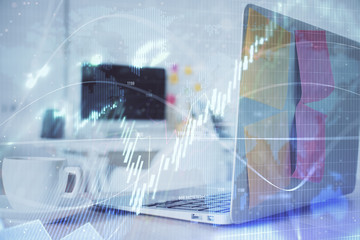 Forex Chart hologram on table with computer background. Double exposure. Concept of financial markets.