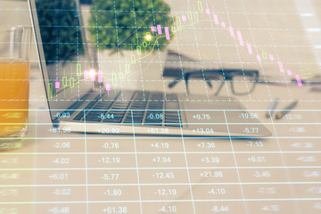 Stock market graph and table with computer background. Double exposure. Concept of financial analysis.